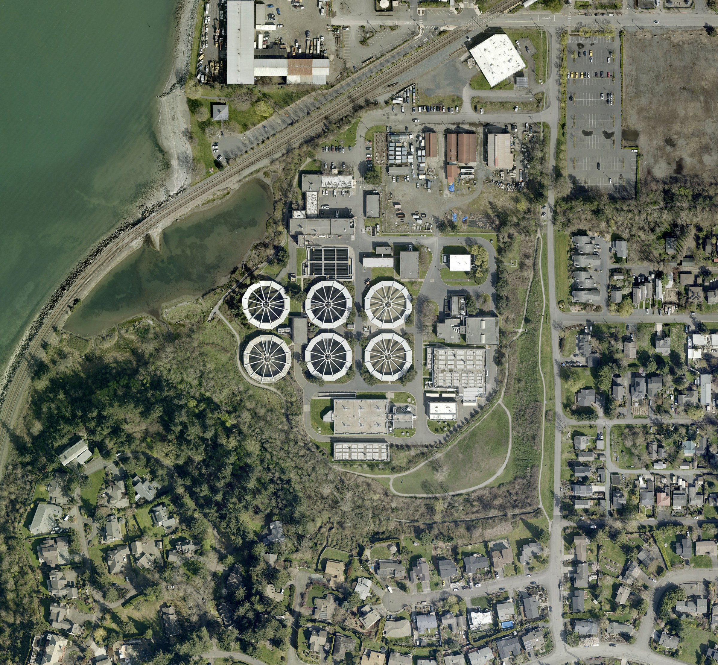 City aerial photo, 2022: Post Point with six round tanks